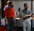 Jaeup Kim receives trophy from Ron Bell Jaeup Kim receives trophy from Ron Bell